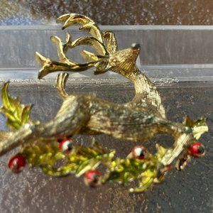 Vintage Gerry's gold tone reindeer and holly branches brooch
